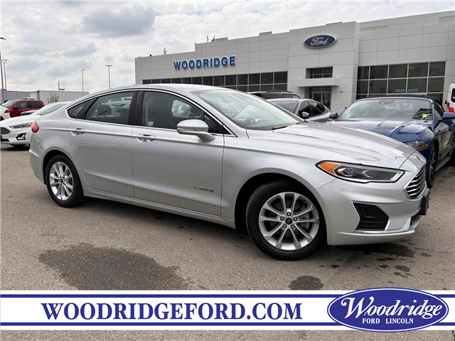 2019 Ford Fusion Hybrid SEL (Stk: P-1384A) in Calgary - Image 1 of 22