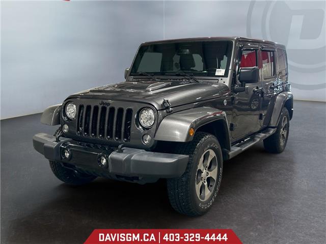 2018 Jeep Wrangler JK Unlimited Sahara 1C4BJWEG6JL824616 302679 in Lethbridge